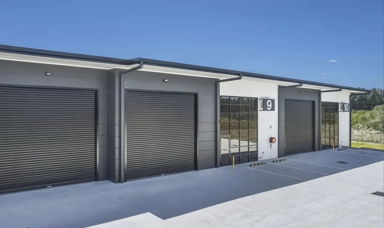 Industrial units with freshly painted walls and roller doors