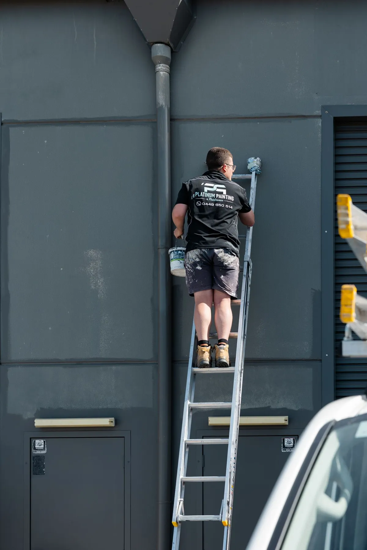 Platinum painter at work on a commercial unit in Beresfield