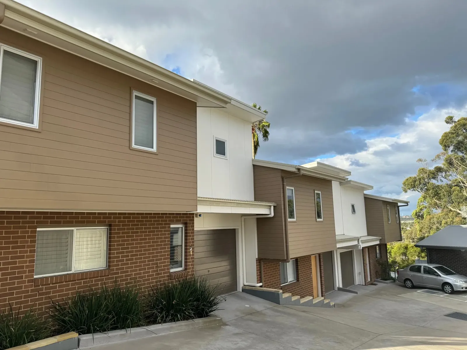 Row of strata townhouses with fresh two-tone exterior paintwork